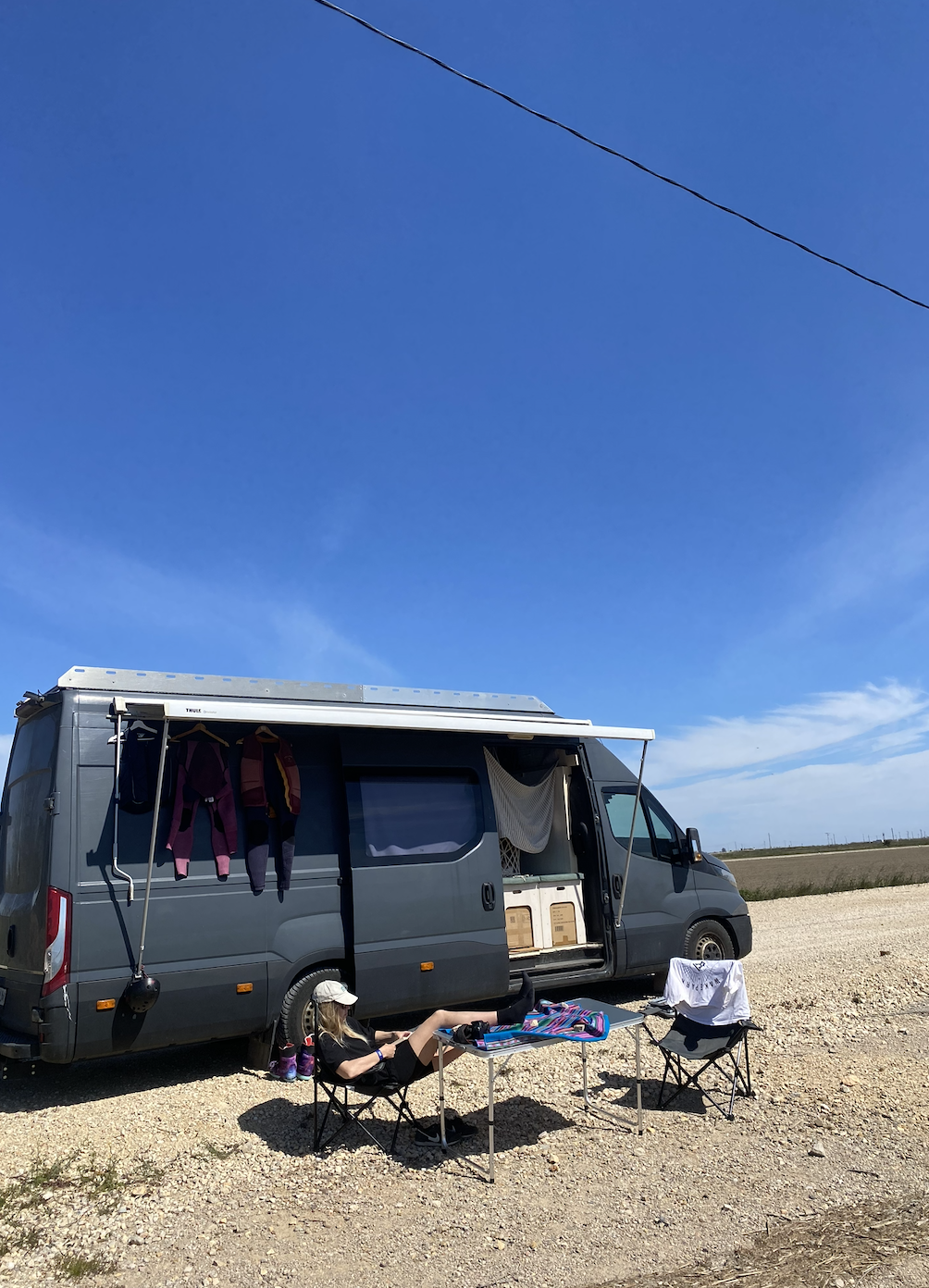 WakeVan parked beside a road under a clear blue sky